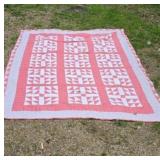 Quilt Features a Repeating Pinwheel Pattern in