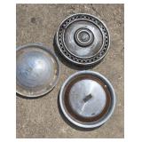 Three antique hubcaps