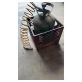 Old Refrigeration bottle in milk crate with hose
