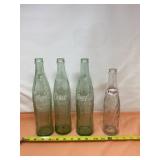 Three One Pint Empty Coke Bottles and 20 Ounce