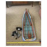 Ironing Board with Two Irons.