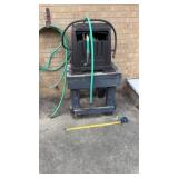 Hose Reel with Hose on Wooden Stand