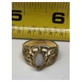 Espo brand ring features a central white stone
