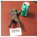 CAST IRON RECLINING FEMALE FIGURE, LOOKS