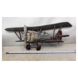 Rustic, handcrafted metal biplane wall sculpture