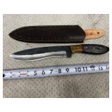 Fixed-blade hunting knife with a forged,