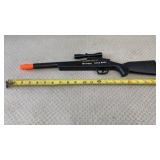 pull-back action toy rifle modeled after a