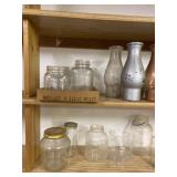 Four Shelves of Glass Jars and Ceramic Pot
