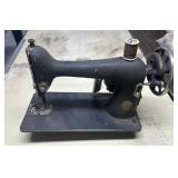 Black Cast-Iron Sewing Machine Head, likely a