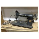 Black and Gold Singer Sewing Machine, Likely a