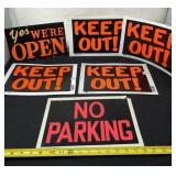 Keep Out, No Parking and Open signs