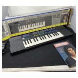 Casio Electronic Keyboard with Cord and Music
