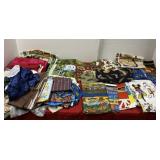 John Deere, Case and All Fabric on Table with