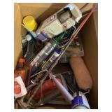 Box of Hardware Including Caulking Guns and Spray