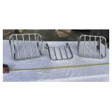 Three polished chrome motorcycle luggage racks
