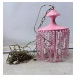Retro pink beaded swag lamp with a metal fixture