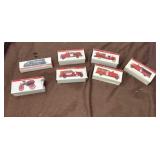 Vintage Die-Cast Toy Fire Truck Models in Their