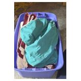 Blankets and sheets in large tote