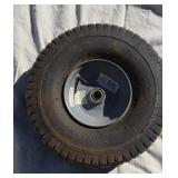 Ridding lawn mower wheel.