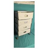Four drawer organizer full of toiletry items