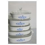 Five pieces of CorningWare covered casseroles