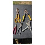 Vice grips  tin snips  pliers.