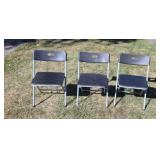 Three plastic folding chairs