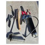 Two grease guns wire brush hole punch