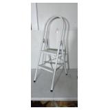 Folding metal step stool.