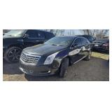 2014 Cadi XTS 2G61N5S37E9285323 Arrest