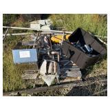 Stainless Steel Scrap Pieces in Two Piles and Additional Random Pieces