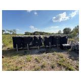 Industrial Tanks With Black Insulation and Metal Frames