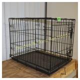 USED MEDIUM SIZE DOG CRATE.