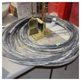 ROLL OF USED HYDRAULIC HOSE.