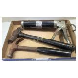 Two hammers and a caulk gun