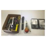 Flat of pens flashlights screwdrivers