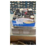 Small  jars contents and ceramic floor tile