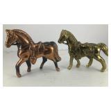 (2) metal saddled horses