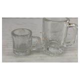 (2) small glass mugs 2.25' tall and 1.25' tall