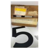 Metal number signs from Shell Oil Company