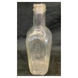 Clear glass Dr Peter Farney & Sons medicine bottle