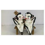 Skunk couple on bench salt & pepper shakers