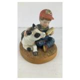 Boy feeding calf ceramic figure 3.75' x 3.5' x 3'