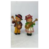(2) Alpine-style musician couple resin figurines
