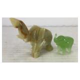 (2) carved stone trumpeting elephants