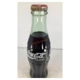 (1) vintage Coca Cola 8oz glass bottle (full)