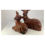 (2) wood bedded down deer
