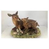 Ceramic doe & fawn on grass bedding