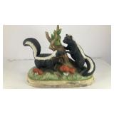 Ceramic skunks by stump 7' x 6' x 3'