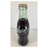 (1) vintage Coca Cola 8oz glass bottle (full)